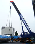 A short-boom crane in operation